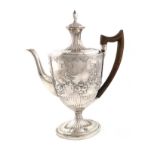 A George III silver coffee pot, by John Robins, London 1792, oval form, scroll handle, later