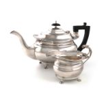 A matched silver teapot and cream jug, by Alexander Clark & Co Ltd, Sheffield 1969, Birmingham 1921,