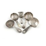 A collection of five antique silver caddy spoons, comprising: one Victorian caddy spoon by George