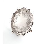 A George III silver waiter, by Ebenezer Coker, London 1763 shaped circular form, shell and scroll
