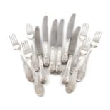 A set of six Russian Soviet era silver table knives and forks, possibly Kiev, the handles with