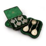 A cased set of four Victorian silver spoons, by William Comyns, London 1892, heart shaped gilt