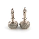 A pair of Victorian silver novelty pepper pots, by George Fox, London 1869, modelled as rosewater
