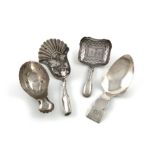 A collection of four antique silver caddy spoons, comprising: a Victorian one by Taylor & Perry,