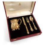 A four-piece cased Victorian silver-gilt christening set, by George Adams, London 1863,