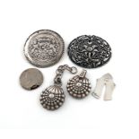 A mixed lot of silver and metalware items, comprising: a French silver cloak clasp, shell ends, a