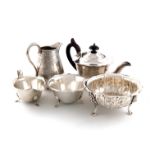 A three piece silver tea set, by Emile Viner, Sheffield 1933, circular form, wavy border edge, on