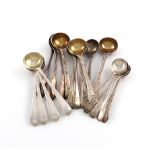 A collection of antique silver condiment spoons, various dates and makers, comprising: a set of