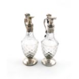 A pair of George III silver mounted glass oil and vinegar bottles, possibly by William Stephenson,