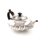 A George IV silver teapot, by George Burrows II, London 1821, squat circular form, part fluting with