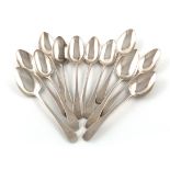 A collection of twelve George III silver Old English pattern dessert spoons, various dates and
