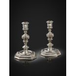 A pair of William III silver candlesticks, maker's mark IL with a coronet above, London 1696,