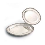 A small pair of George III silver meat platters, by William Fountain, London 1802, of shaped oval