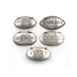 A collection of five antique silver wine labels, comprising: one incised 'PORT' and another '