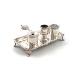 A small 18th century silver inkstand, unmarked, rectangular form, fluted carrying handle, with a pen