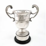 A silver two-handled trophy cup, by The Barker Brothers, Birmingham 1928, circular form,