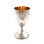 A George III silver goblet, by John Emes, London 1806, plain urn bowl, gilded interior, on a