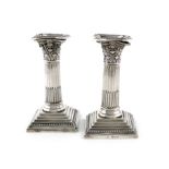 A pair of late-Victorian silver dwarf candlesticks, by William Hutton and Sons, London 1894,