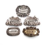 A collection of five 19th century silver wine labels, comprising: a George III pair by Phipps and