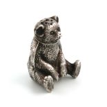 An Edwardian novelty silver teddy bear pepper pot, by H V Pithey & Co., Birmingham 1909, modelled in