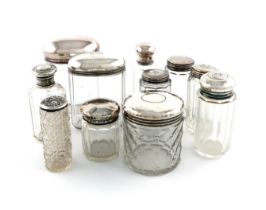 A collection of nine silver-mounted and dressing table jars, various dates and makers, various