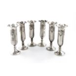 A matched set of six late Victorian and Edwardian silver trumpet vases, by Thomas Bradbury & Sons,