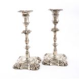 A pair of Victorian cast silver candlesticks, by Samuel Whitford, London 1856, in the George II