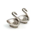 A pair of Edwardian continental silver swan pepper pots, import marks for Chester 1906, importer's