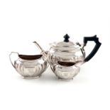 A three-piece Victorian silver tea set, by Atkin Brothers, Sheffield 1892-3, oblong bellied form,