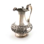 An early Victorian Irish silver hot water ewer, no apparent maker's mark, Dublin 1837, lobed