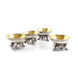 A set of four Victorian silver-gilt salt cellars, by Smith, Nicholson & Co., London 1852, circular