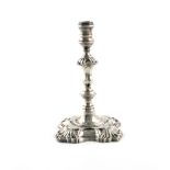A George II silver taper stick, by William Gould, London 1751, knopped stem, shell shoulder, on a