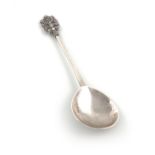 By The Artificers' Guild Ltd., an Arts and Crafts silver spoon, London 1936, fig shaped bowl with