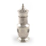 By A E Jones, an Arts and Crafts silver sugar caster, Birmingham 1932, circular bellied form, spot-