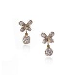 A pair of diamond drop earrings, the quatrefoil flowerhead tops set with old cushion-shaped