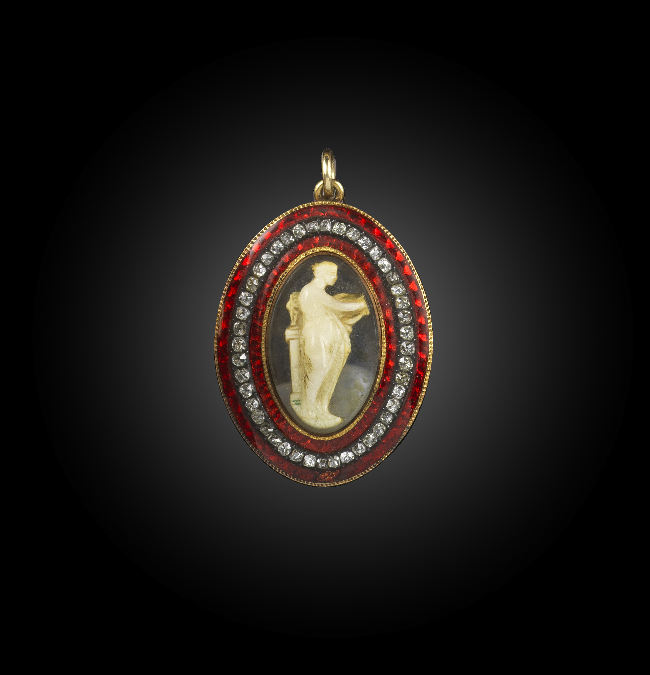 A hardstone cameo, enamel and diamond pendant, circa 1800, set with a oval cameo of the muse