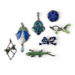 A selection of Arts & Crafts jewellery, including a silver and enamel pendant by William Hair