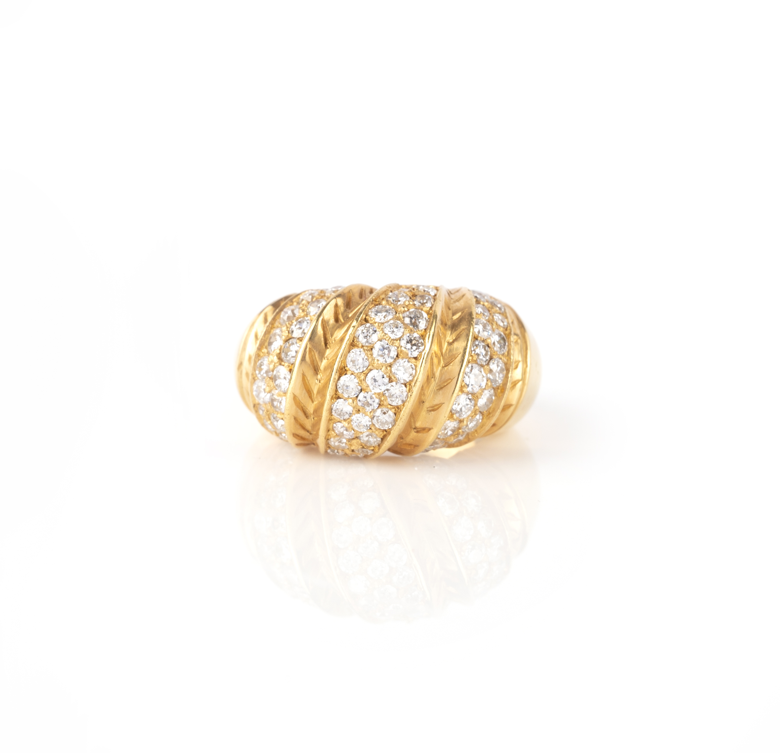 A diamond ring, of bombé form, the front of twist design, pavé-set with stripes of circular-cut - Image 2 of 2