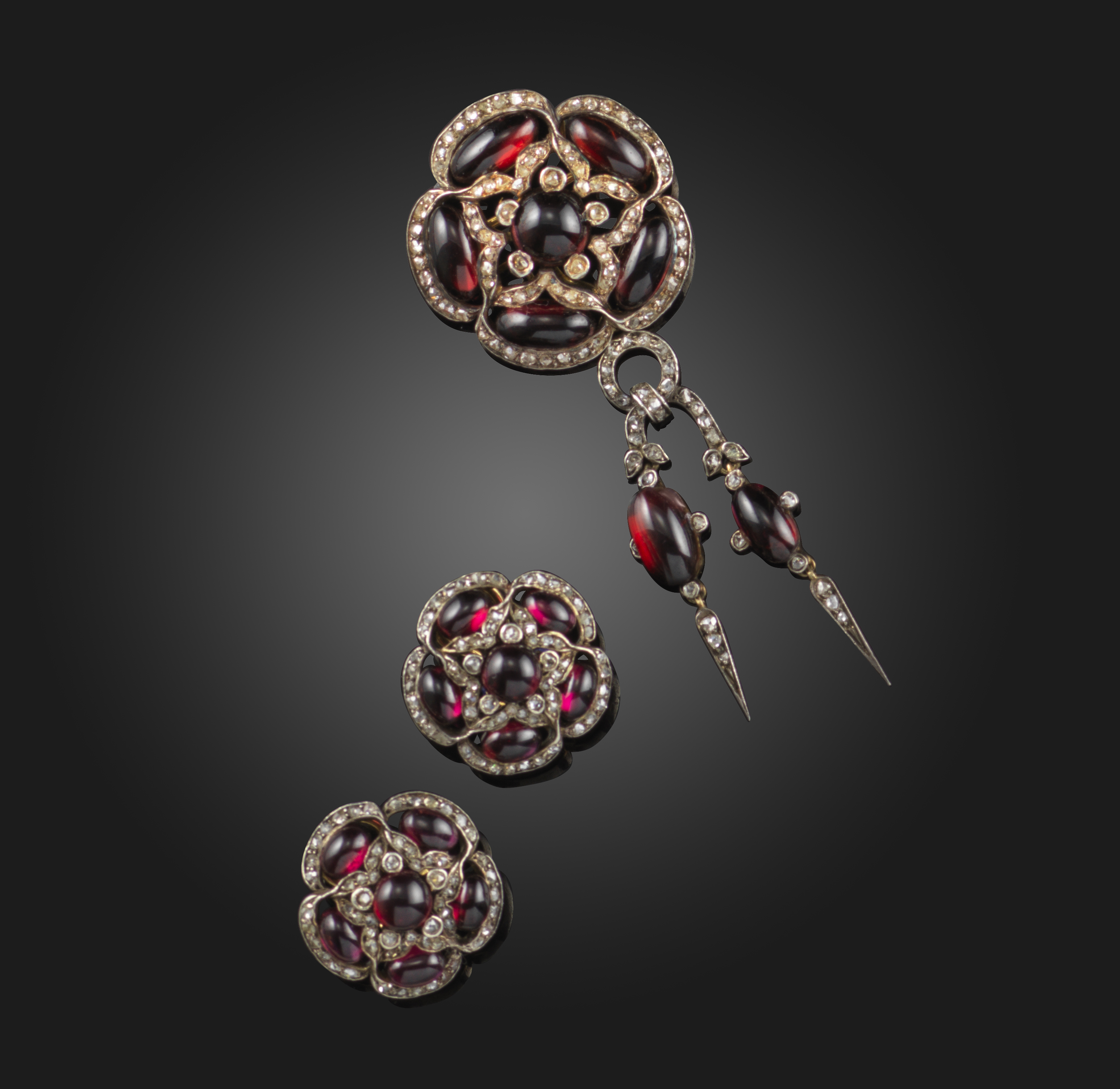 A garnet and diamond demi-parure, mid 19th century and later, and a citrine ring, comprising: a