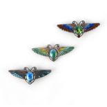 Charles Horner, three Arts and Crafts enamel brooches, early 20th century, each designed as a winged