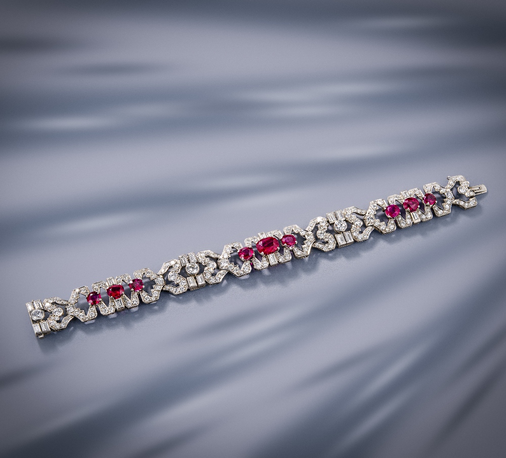 An Art Deco ruby and diamond bracelet, circa 1930, of geometric design, set with oval rubies and - Image 2 of 2