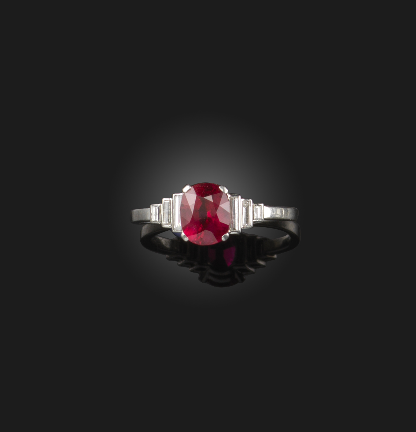 An Art Deco ruby and diamond ring, 1930s, set with an oval ruby weighing 1.36 carats