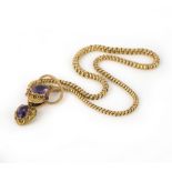 A late Victorian amethyst-set gold snake necklace, the realistically formed head set with an oval