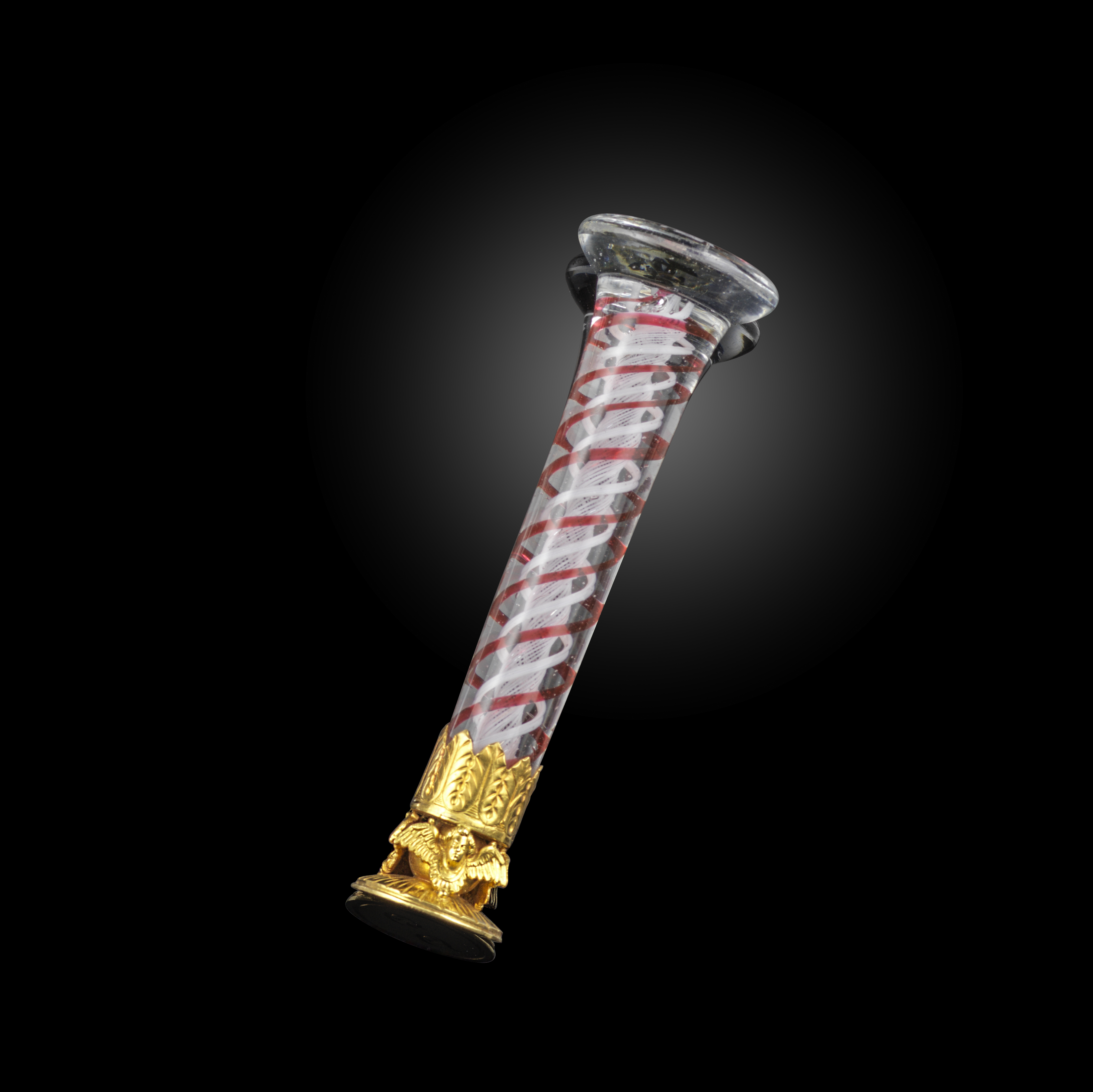 A glass and gold desk seal, France, circa 1833, the flaring cylindrical glass handle with red and