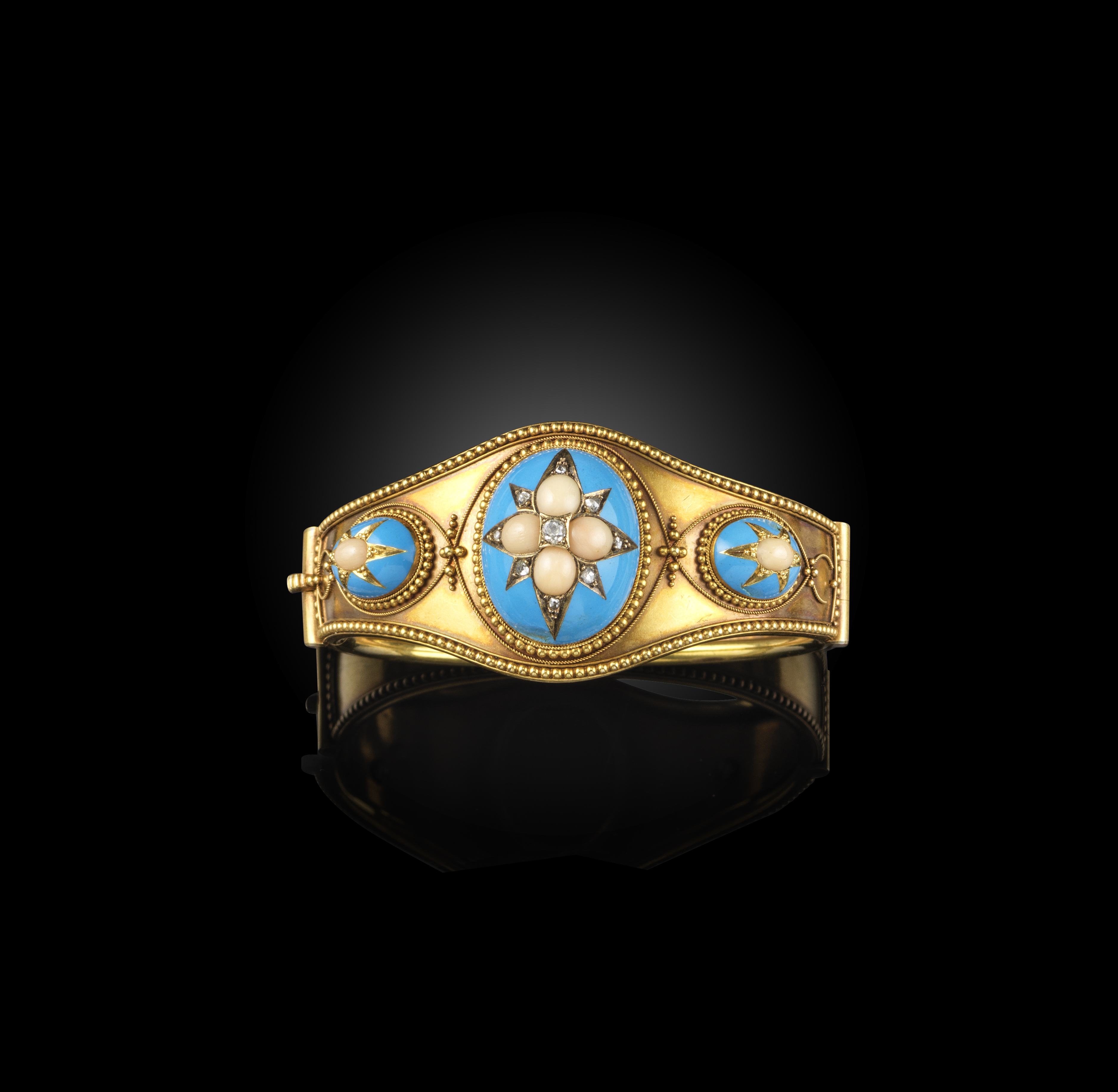 λ A Victorian gold, coral, enamel and diamond bangle, mid 19th century, the hinged bangle applied