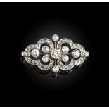 An Edwardian diamond brooch, circa 1910, the openwork brooch designed as a confronted pair of