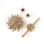 Two brooches, late 19th century and a pair of earrings, including a gold sunburst brooch set with