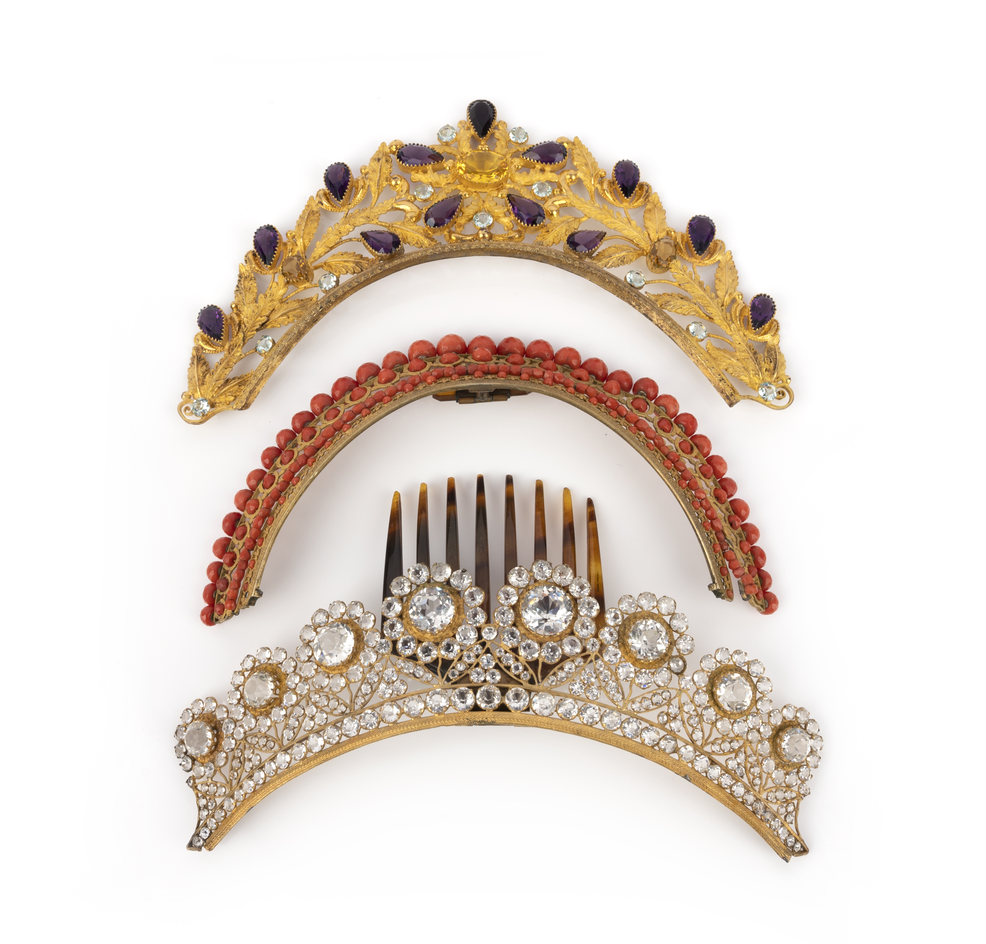 λ Three hair ornaments, mid 19th century, comprising: a hair ornament designed as a band of gilt