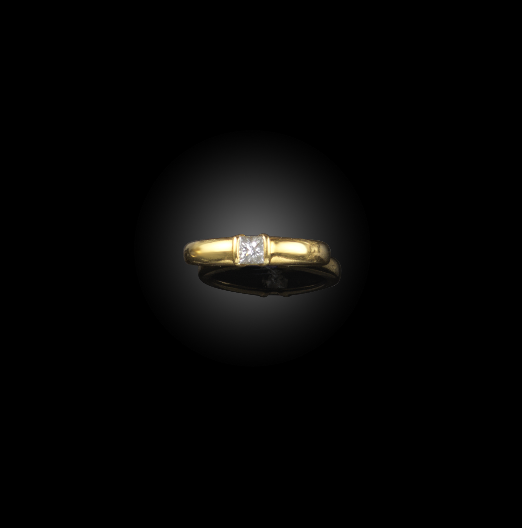 Van Cleef and Arpels, a diamond ring, the gold band tension-set with a princess-cut diamond, size L,