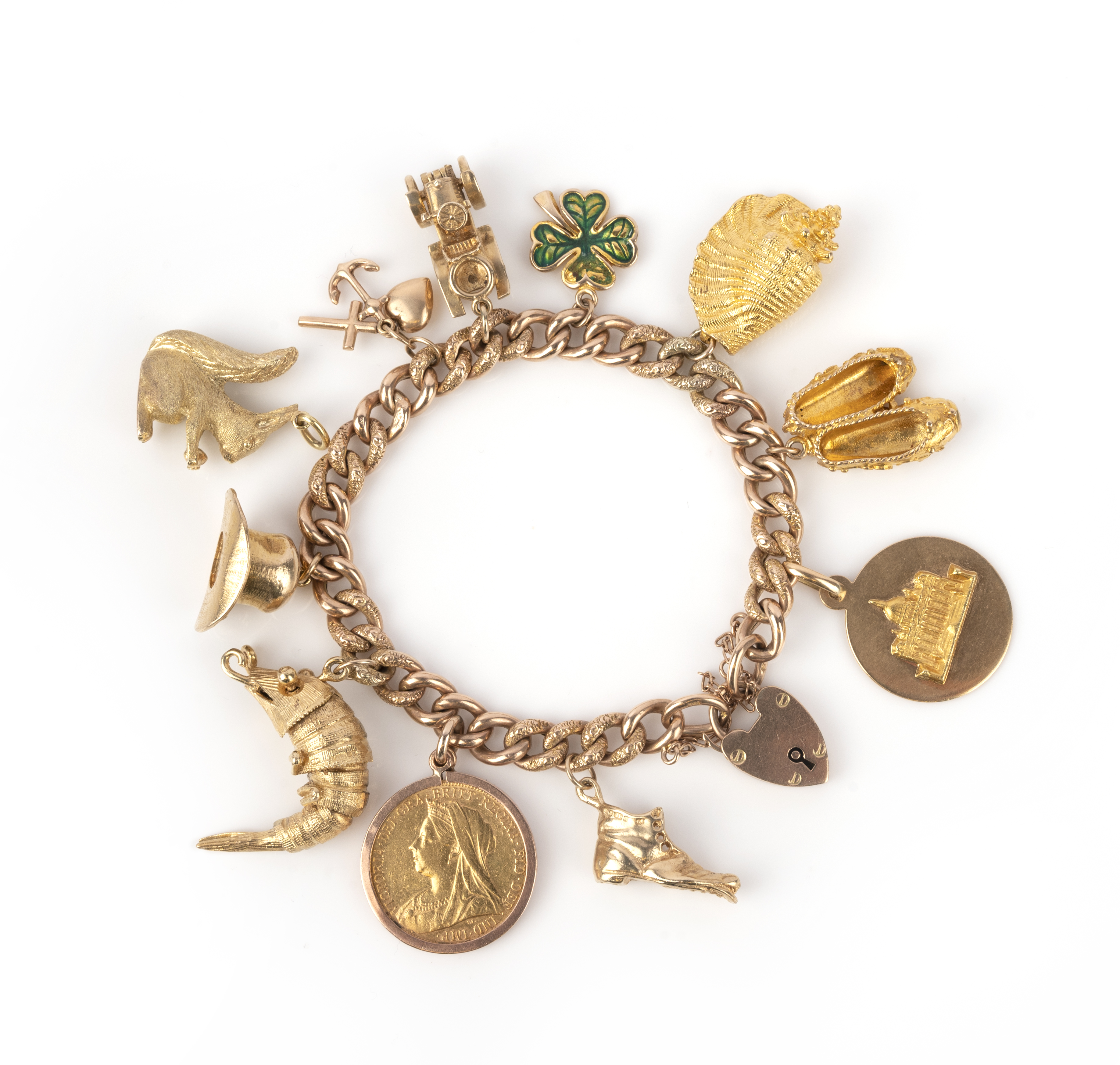 A gold charm bracelet, the curb link bracelet with stamped floral decoration suspending eleven